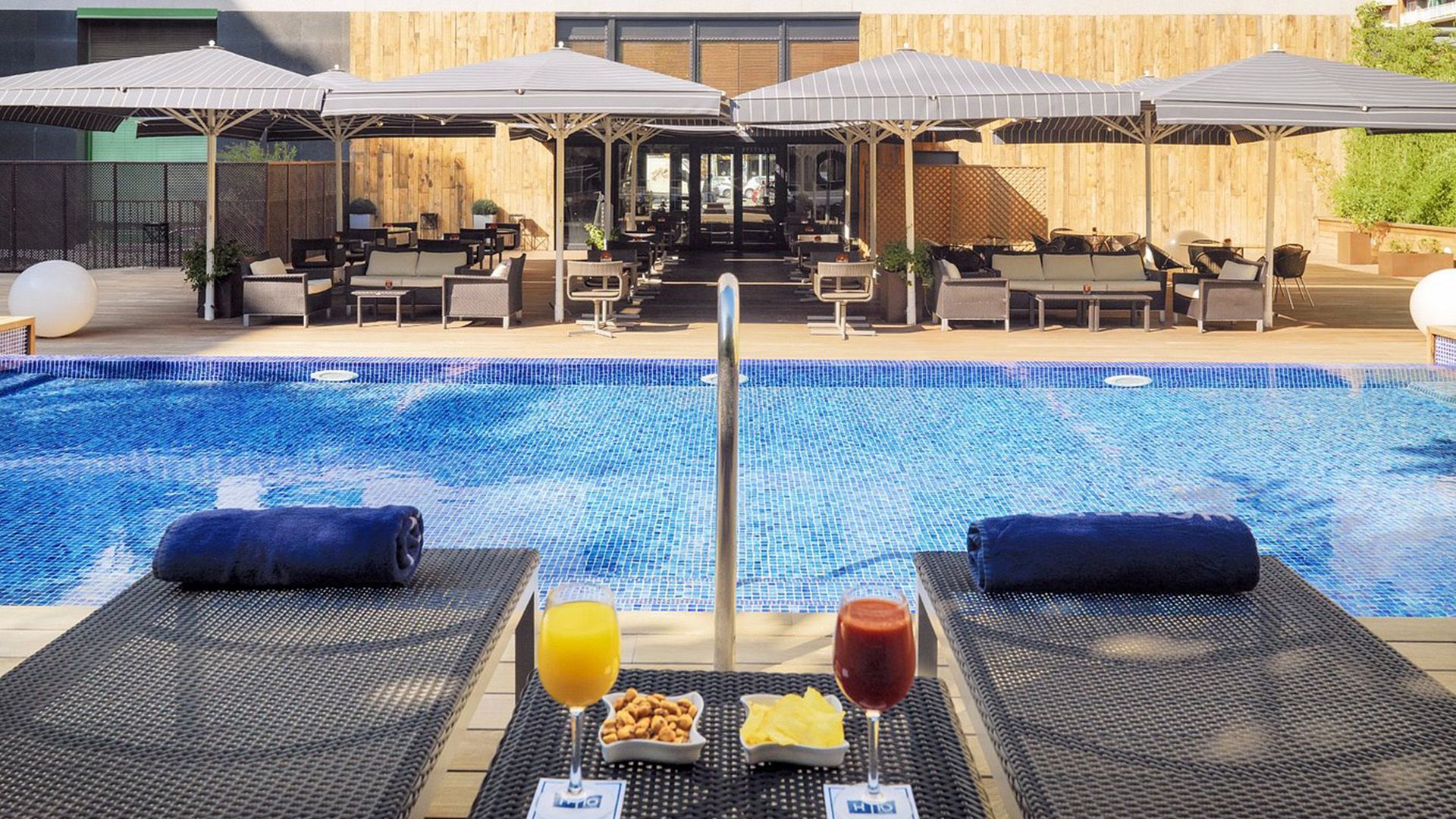 Modern Barcelona Urban Escape with Daily Breakfast, Welcome Cocktail & Outdoor Pool