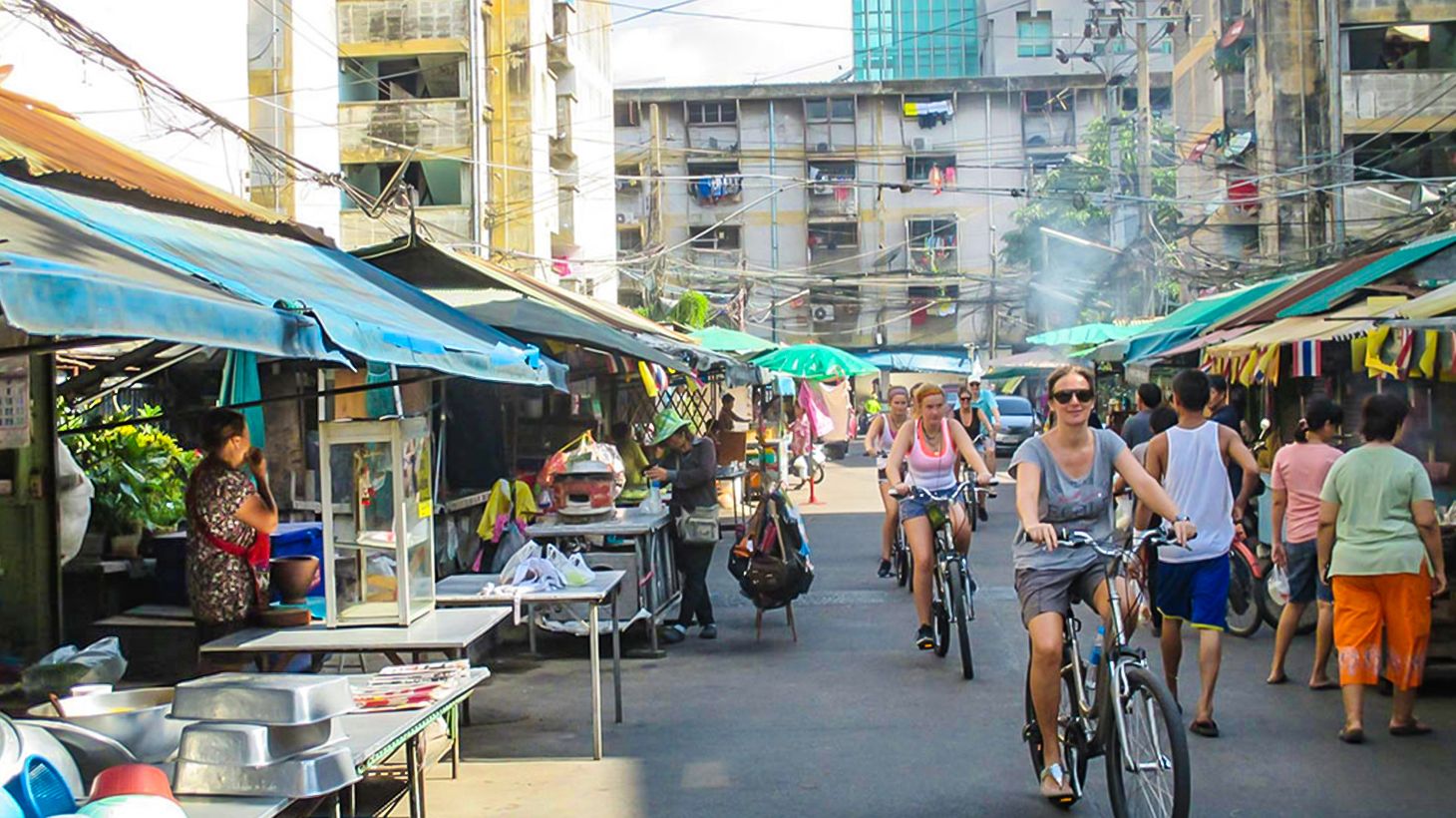 Explore the Bustling City & Backstreets on an Afternoon Biking Tour with Snacks & Drinks 3