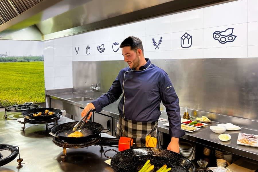 Paella cooking class with optional central market tour in Valencia