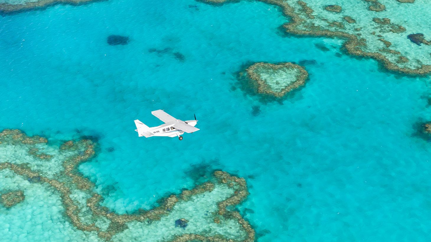 60-Minute Reef Scenic Flight & Full-Day Ocean Rafting Package with Lunch & Transfers 4