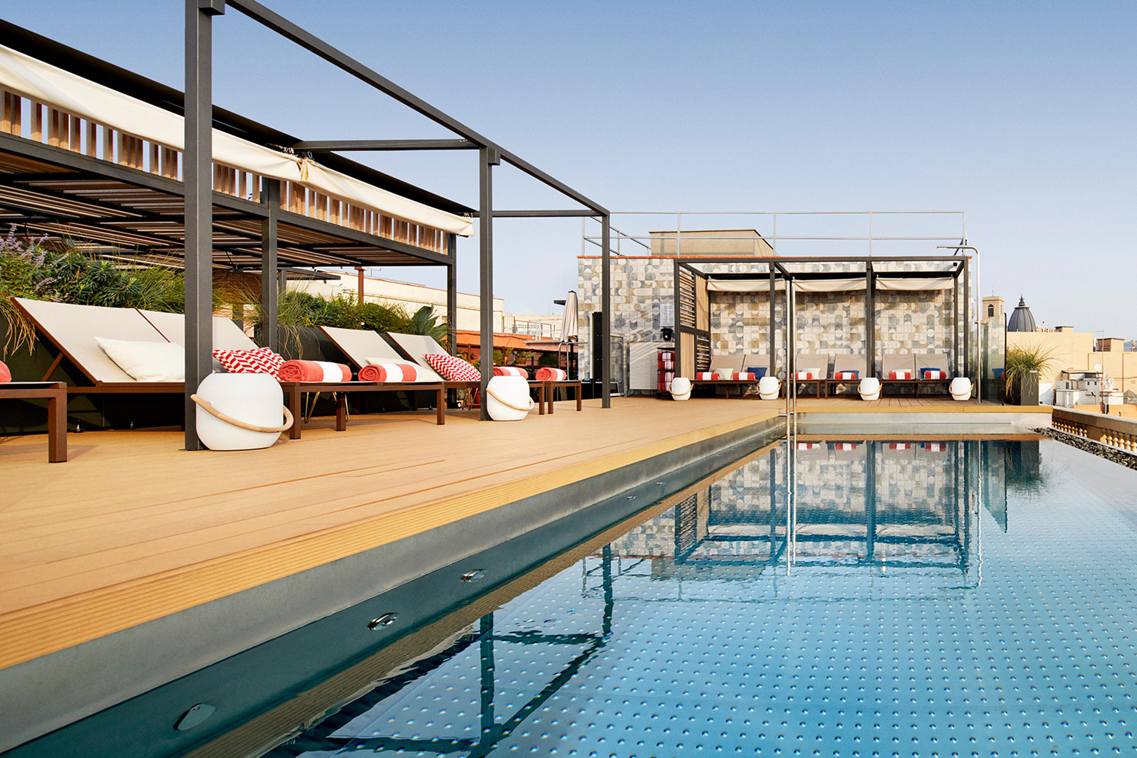 Rooftop pool at Kimpton Vividora Barcelona, an IHG Hotel in Barcelona's Gothic Quarter.