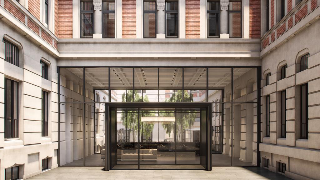 Exterior view of Kozmo Hotel Budapest with modern glass entrance.