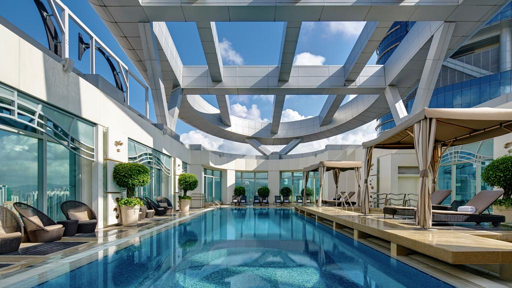 Rooftop pool at Cordis Hong Kong with stunning architectural design.