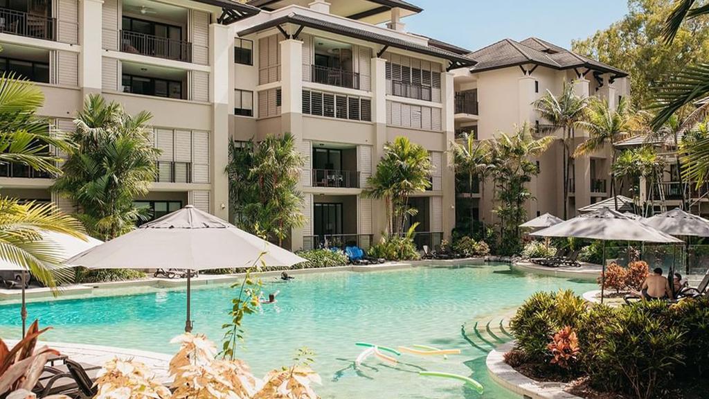 Tropical resort with lagoon-style pool and lush gardens in Palm Cove.