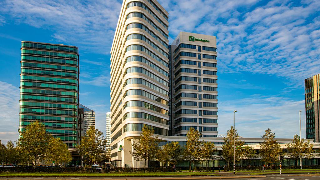 Modern hotel buildings of Holiday Inn Amsterdam near Johan Cruijff Arena.