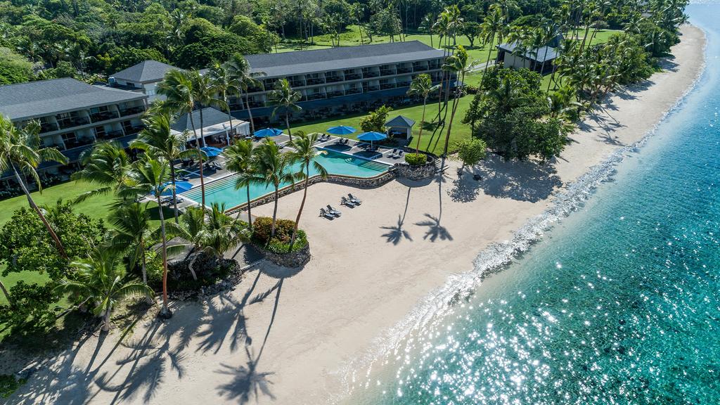 Aerial view of Shangri-La Yanuca Island resort with private beach and pool.