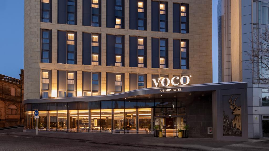 Exterior of voco Edinburgh – Haymarket hotel at twilight.