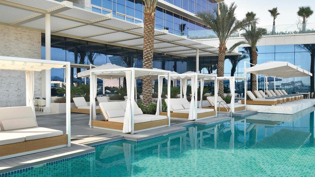 Luxurious poolside cabanas at a five-star Dubai hotel.