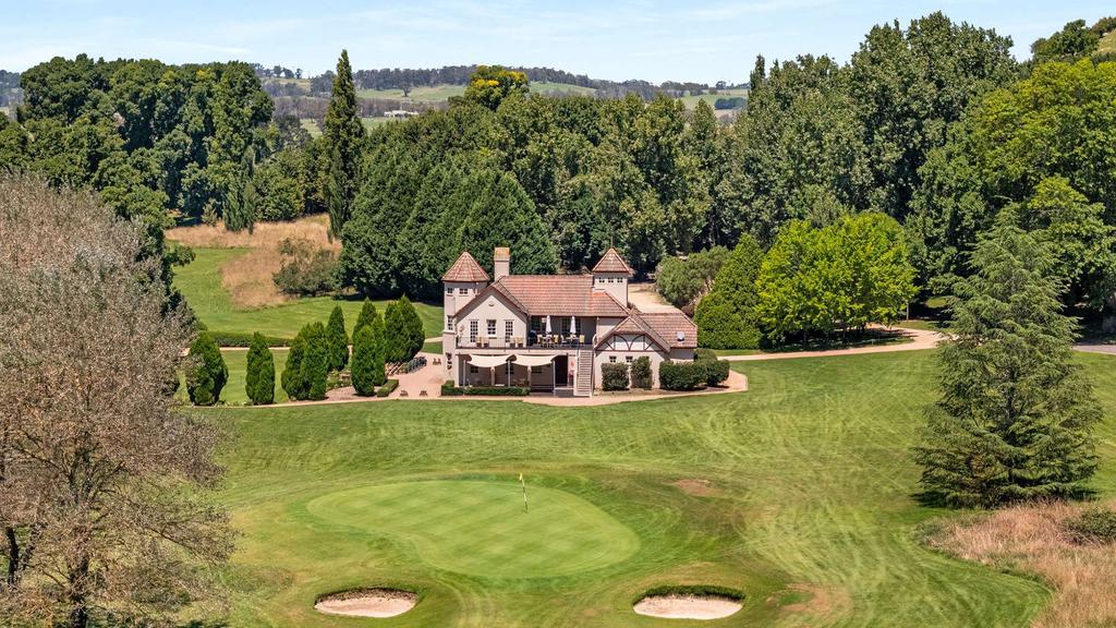 A charming manor surrounded by Southern Highlands greenery and a golf course.