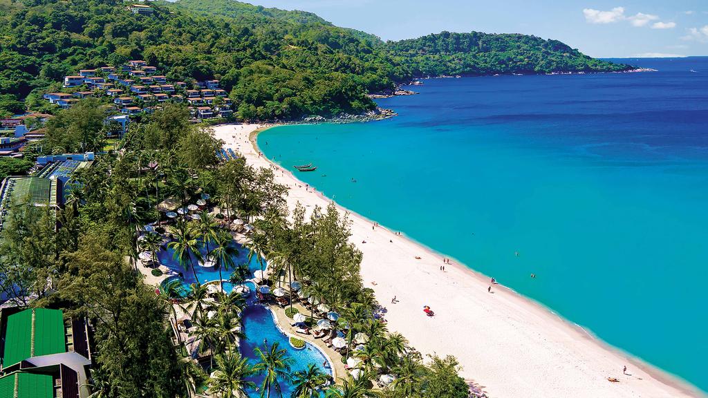 Aerial view of Katathani Phuket Beach Resort with lush greenery and multiple pools.