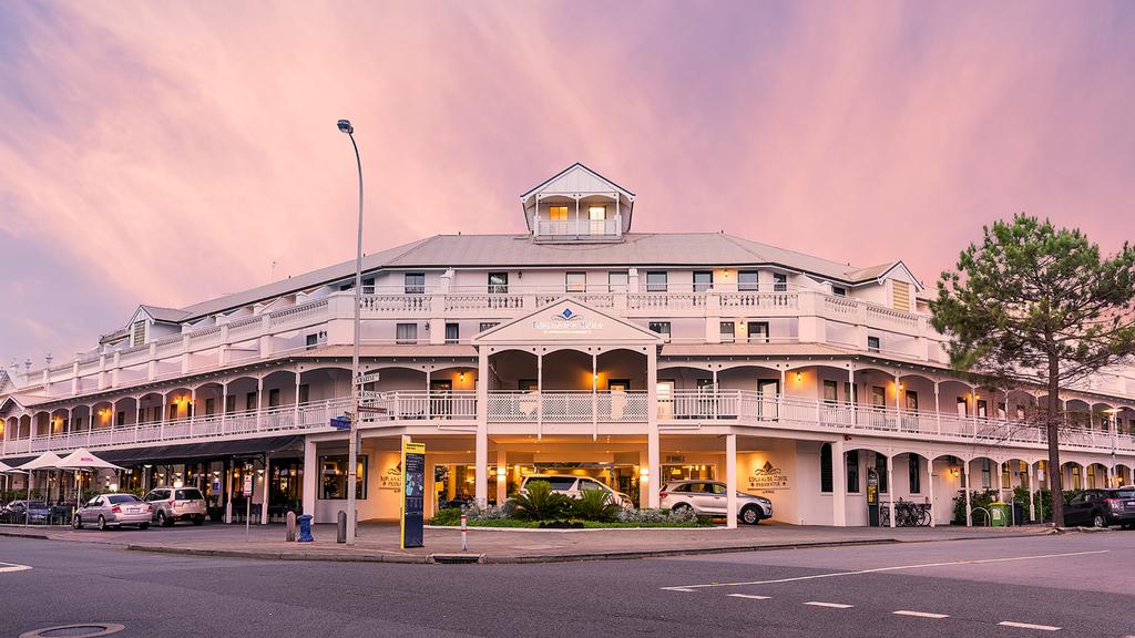 Heritage Esplanade Hotel Fremantle at sunset with historical architecture.