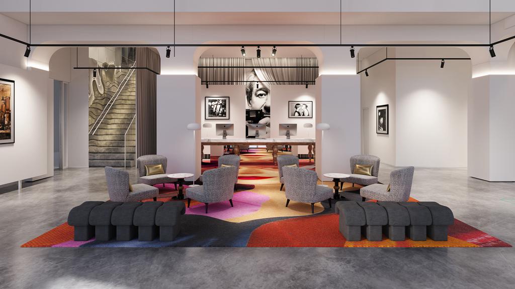 Modern hotel lobby with stylish seating and vibrant decor.