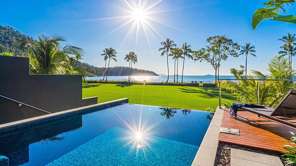 Infinity pool overlooking a tropical landscape at Funnel Bay.