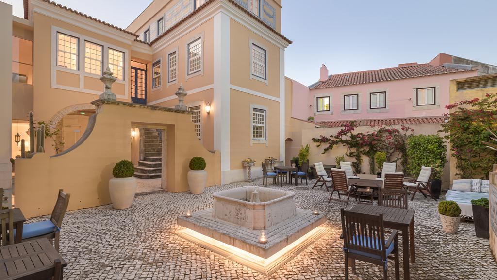 Solar Do Castelo’s historic courtyard within Lisbon’s 18th-century castle walls.