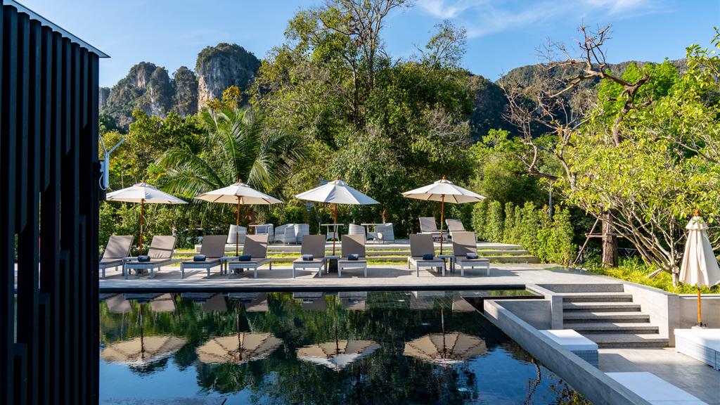 Pool at Anana Ecological Resort Krabi with limestone cliff views in Thailand.