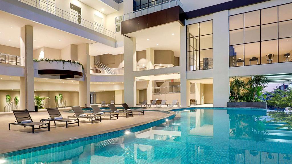 Elegant outdoor pool area at Mercure Bengkulu hotel.