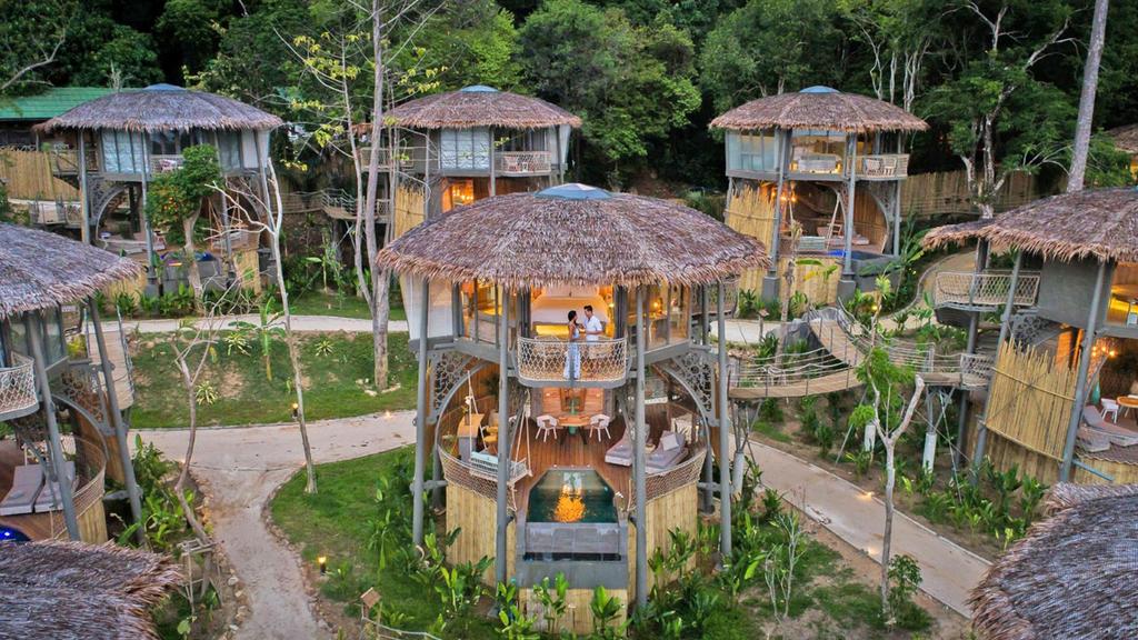 Beachfront treehouse villas with outdoor plunge pools in Thailand.