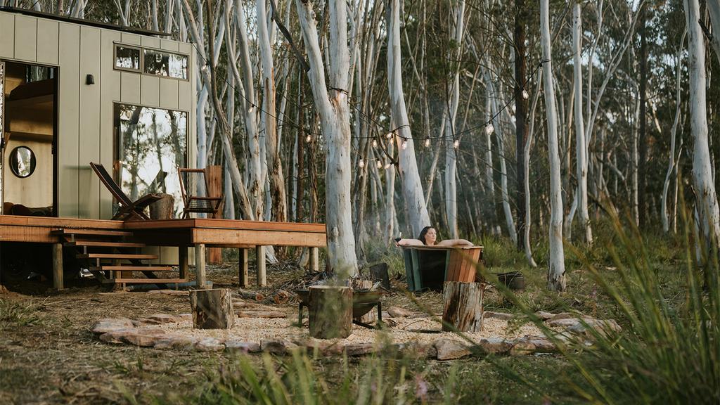 Boutique off-grid cabin in a eucalyptus forest with outdoor bathtub.