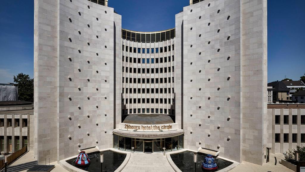 Circular hotel in Cologne with modern architecture and artistic design.