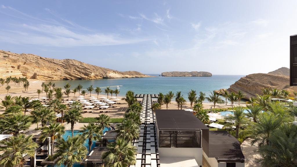 Stunning view of Jumeirah Muscat Bay with beach and ocean.