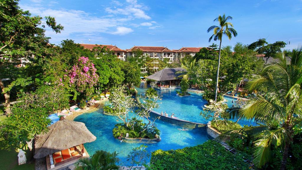 Aerial view of Novotel Bali Nusa Dua with lagoon pool and lush gardens. 
