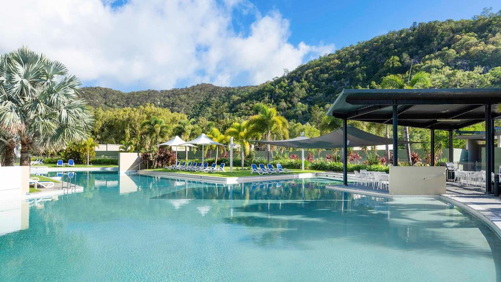 Resort pool area surrounded by lush greenery on Magnetic Island.