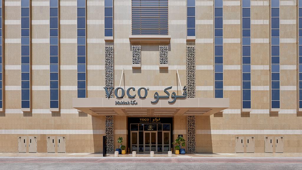 Facade of voco Makkah hotel with modern architectural design.