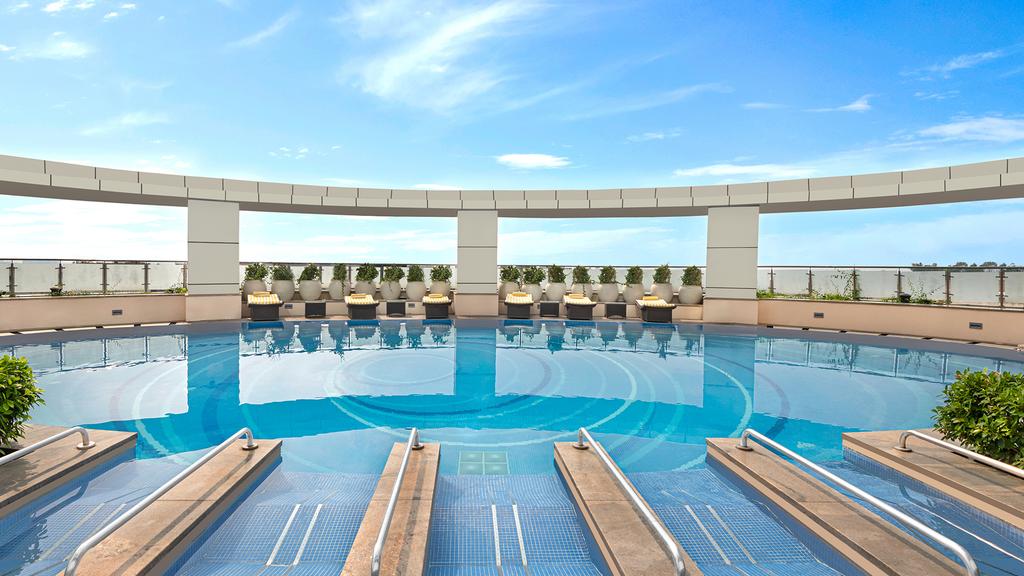 Rooftop pool at Crowne Plaza Greater Noida, an urban sanctuary in India.