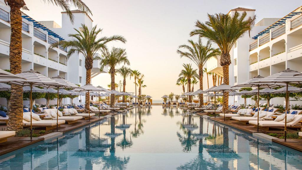 Luxurious pool area at METT Marbella – Estepona resort in Costa del Sol.