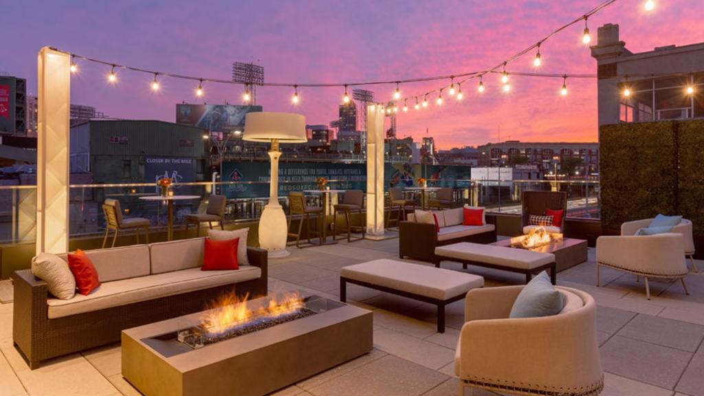 Rooftop lounge at Hotel Commonwealth with a view of Fenway Park.