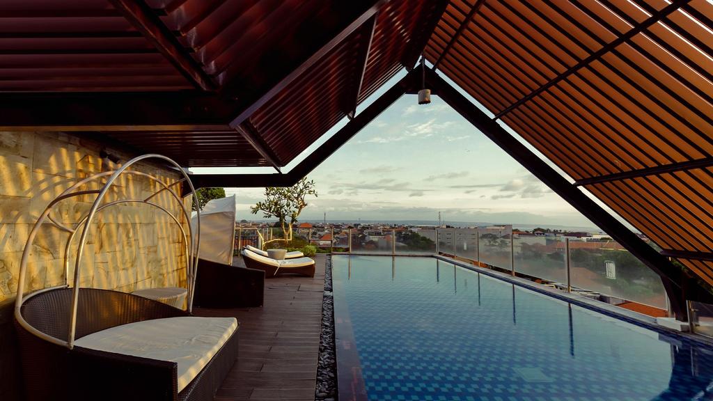 Rooftop pool with city views at Luminor Hotel Legian Seminyak Bali. 