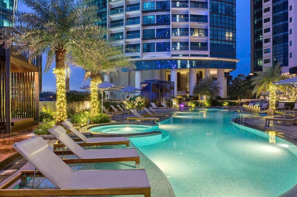 Luxurious outdoor pool at a Kuala Lumpur hotel at night.