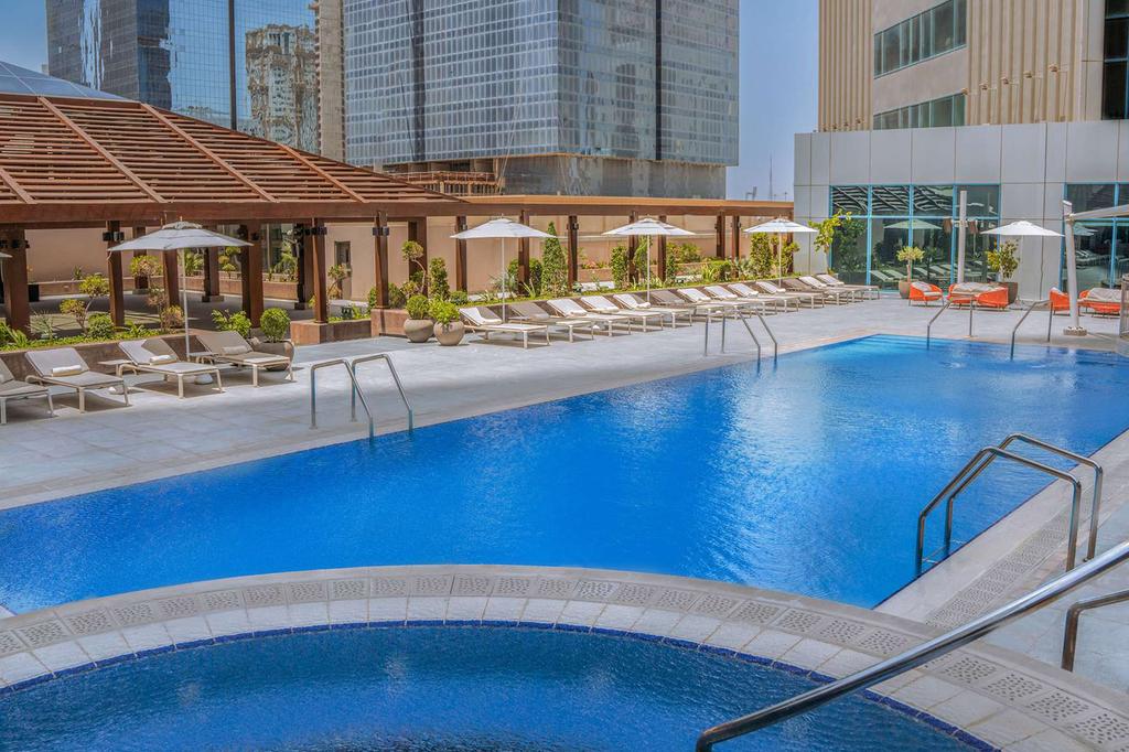 Outdoor pool at Pullman Doha West Bay 
