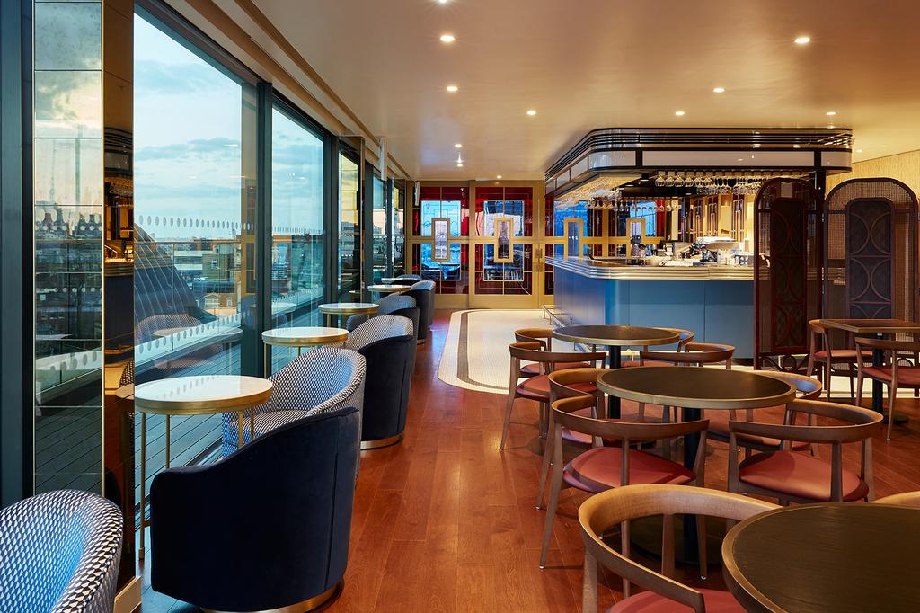 Rooftop bar with elegant seating and panoramic city views in London.