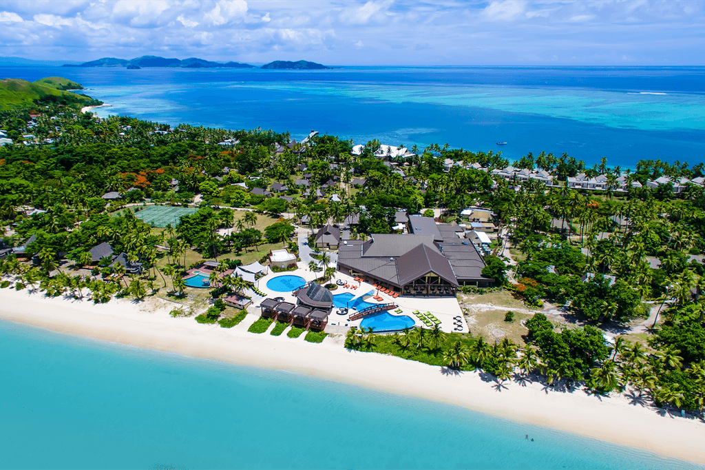 Aerial view of Mana Island Resort with turquoise waters and sandy beaches. 