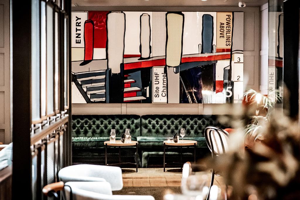 Stylish seating area with modern artwork in a Sydney hotel.