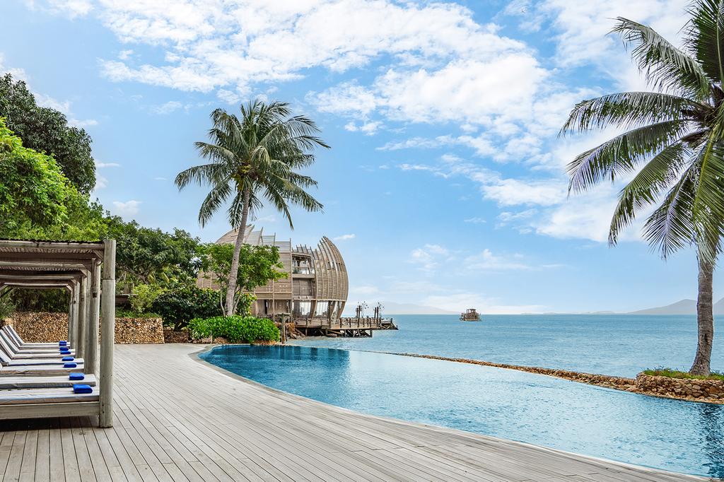 A luxurious jungle villa retreat with beachfront and infinity pool.