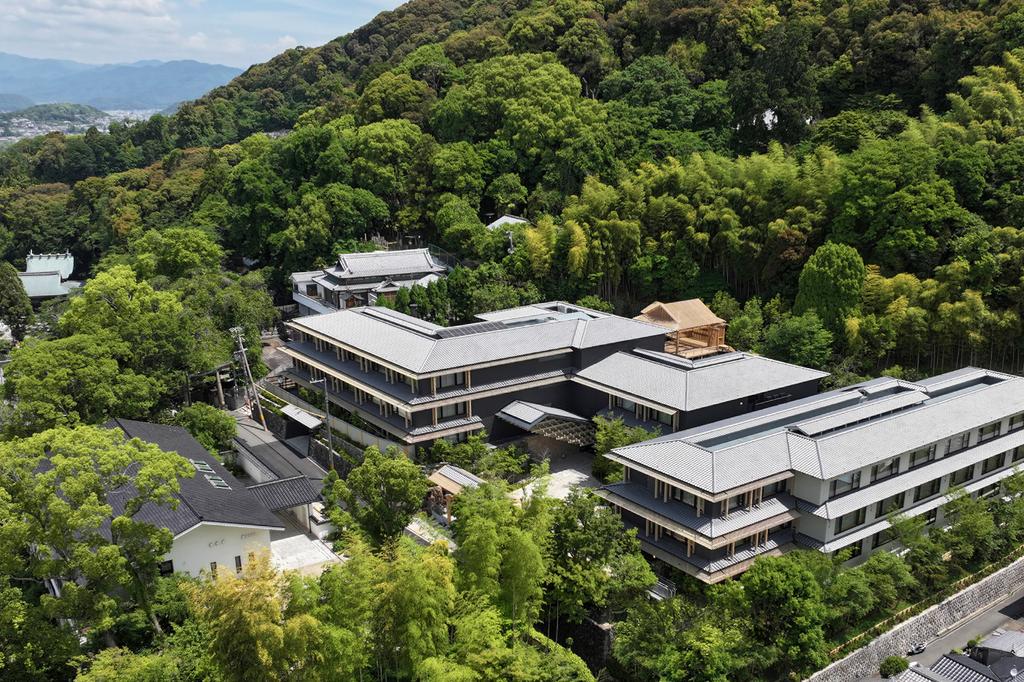Aerial view of Banyan Tree Higashiyama Kyoto surrounded by lush greenery.