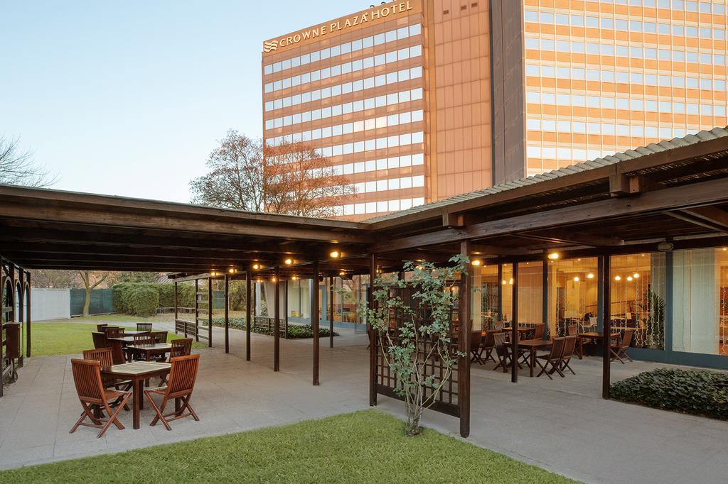 Outdoor seating area at Crowne Plaza Milan — Linate, an IHG Hotel.