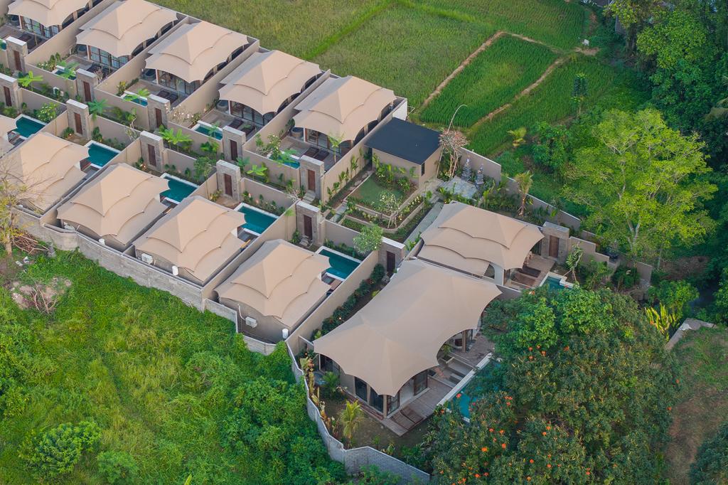 Aerial view of luxury Ubud glamping villas with private pools.