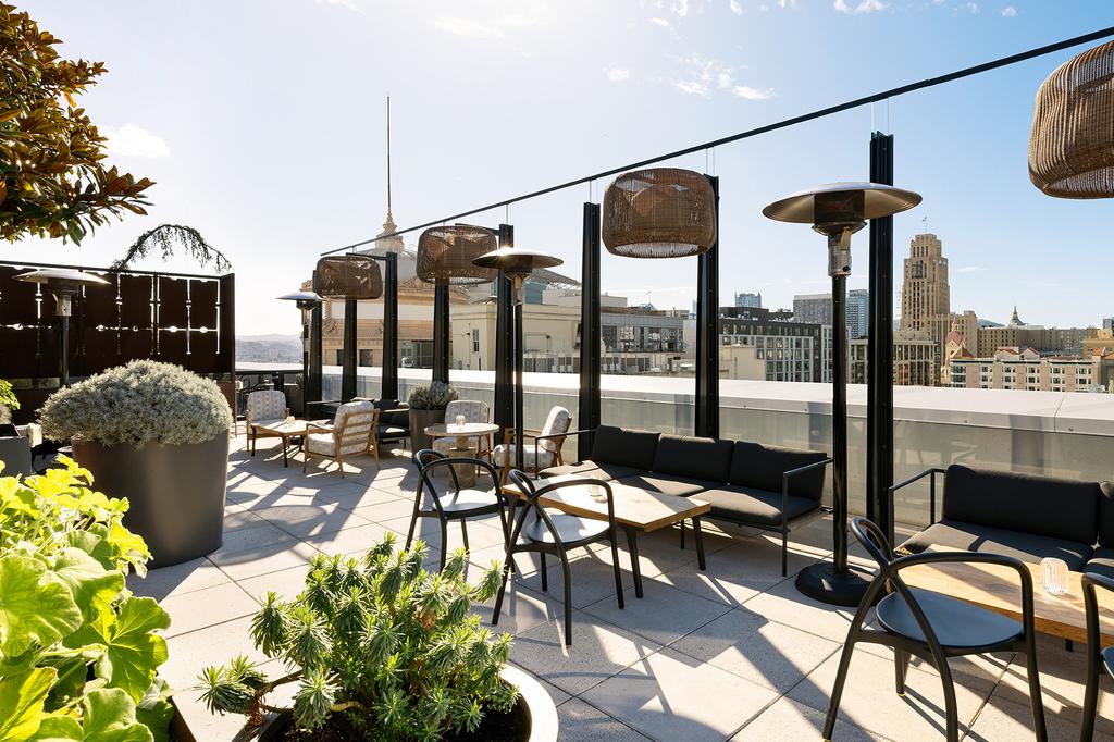 Rooftop seating with city view at Timbri Hotel San Francisco, Curio Collection by Hilton.