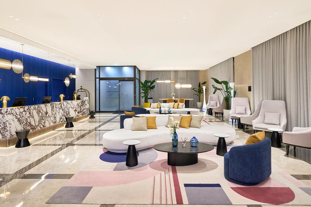 Elegant hotel lobby with modern design and plush seating.