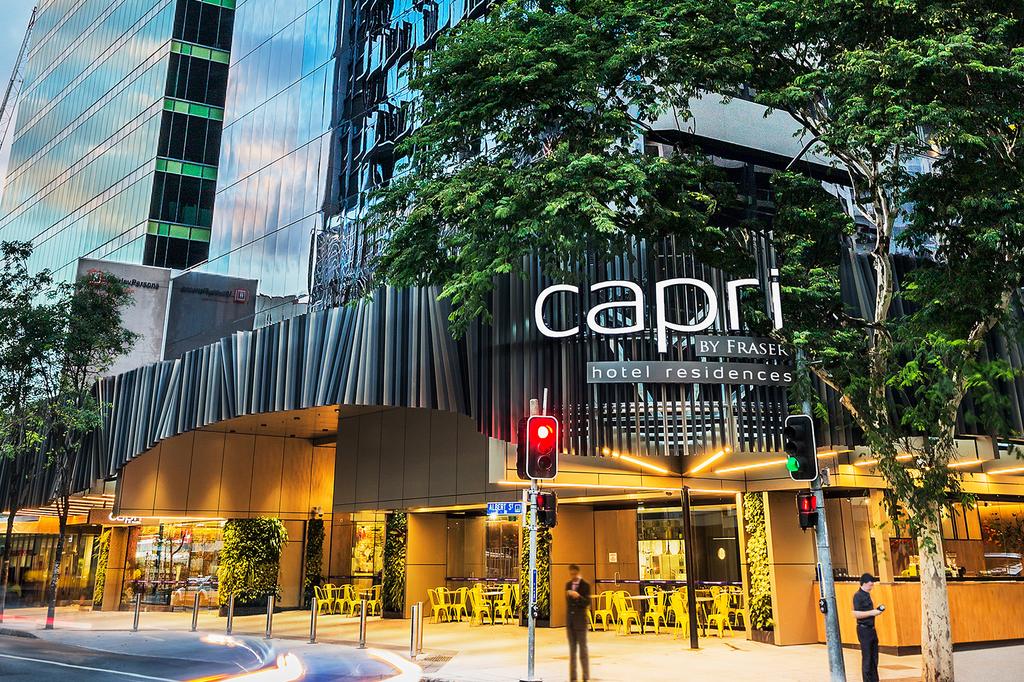 Capri by Fraser Brisbane hotel with vertical gardens and modern facade.