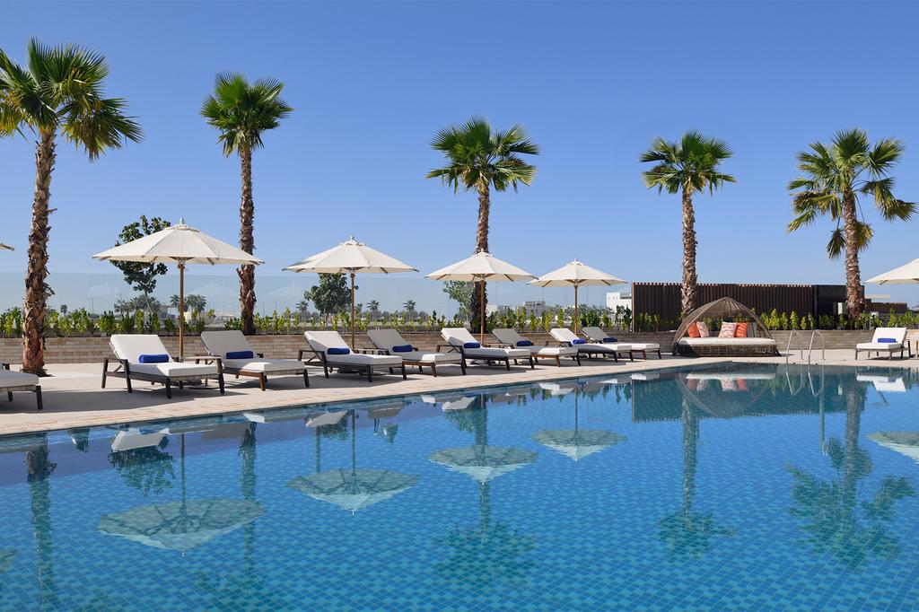 Outdoor pool with sun loungers at Abu Dhabi's InterContinental Residences.