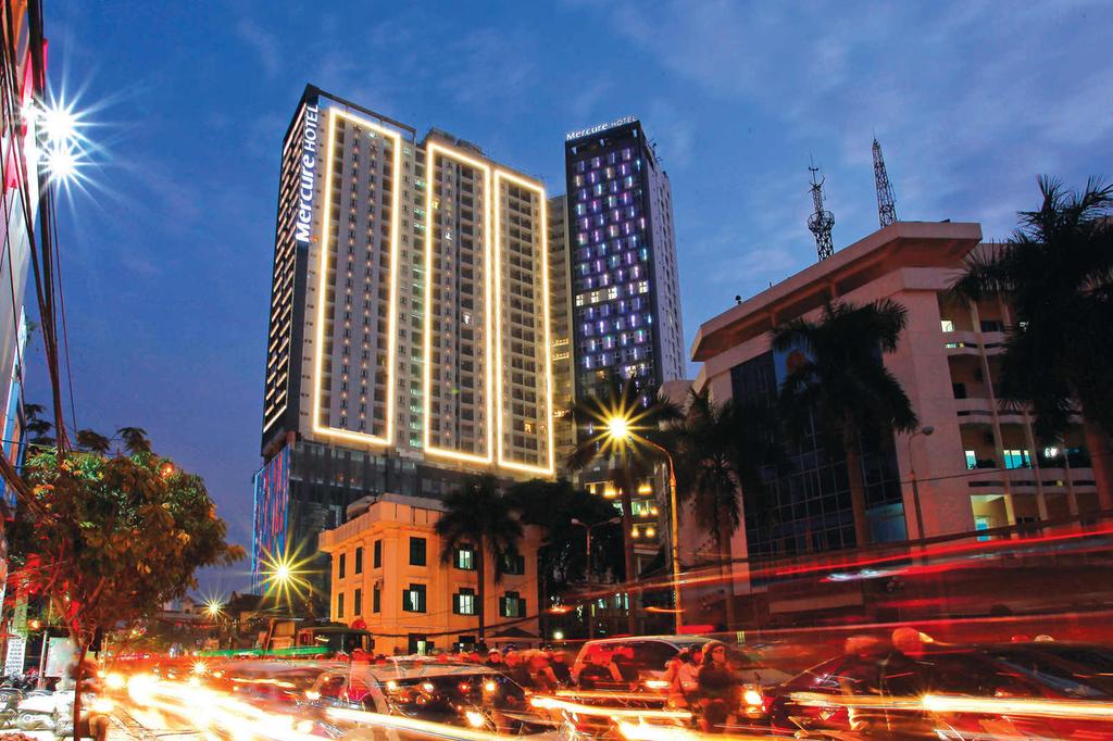 Exterior view of Mercure Hotel in Hai Phong at night.