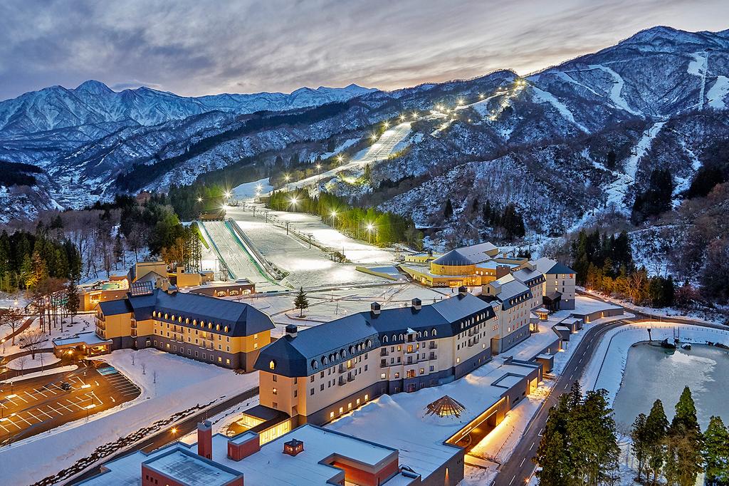 Lotte Arai Resort near Tokyo with snow-covered slopes and illuminated ski trails.