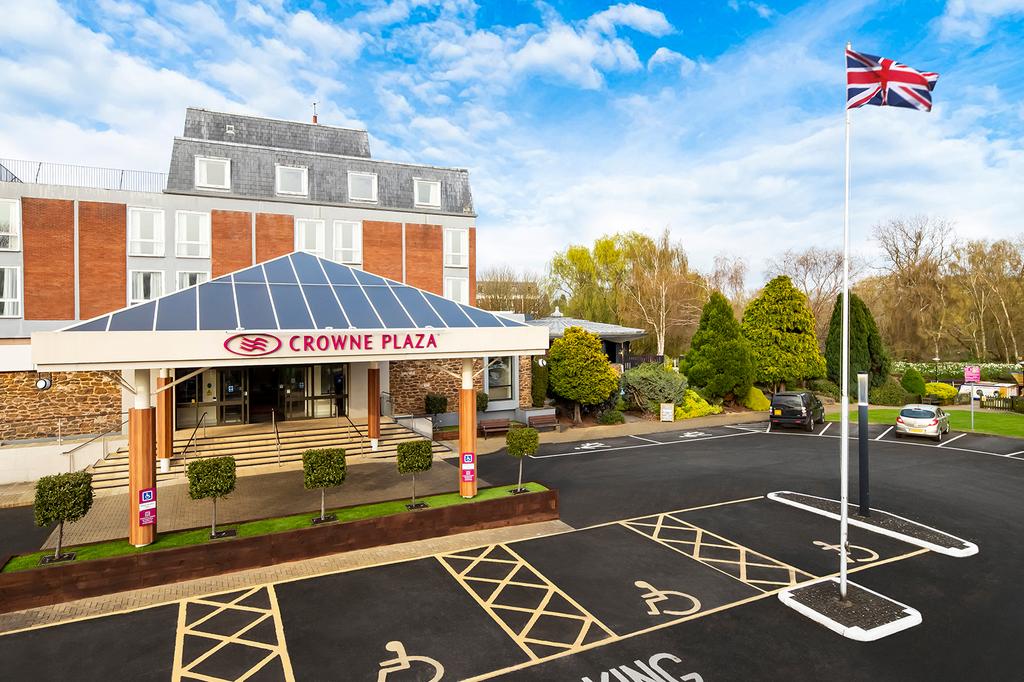 Crowne Plaza Stratford Upon Avon entrance with UK flag flying.