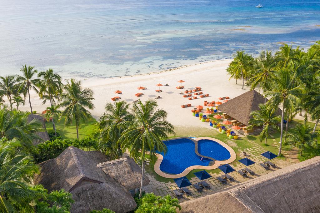 Ocean view of Palm-lined private beach at Oceanica Resort Panglao.