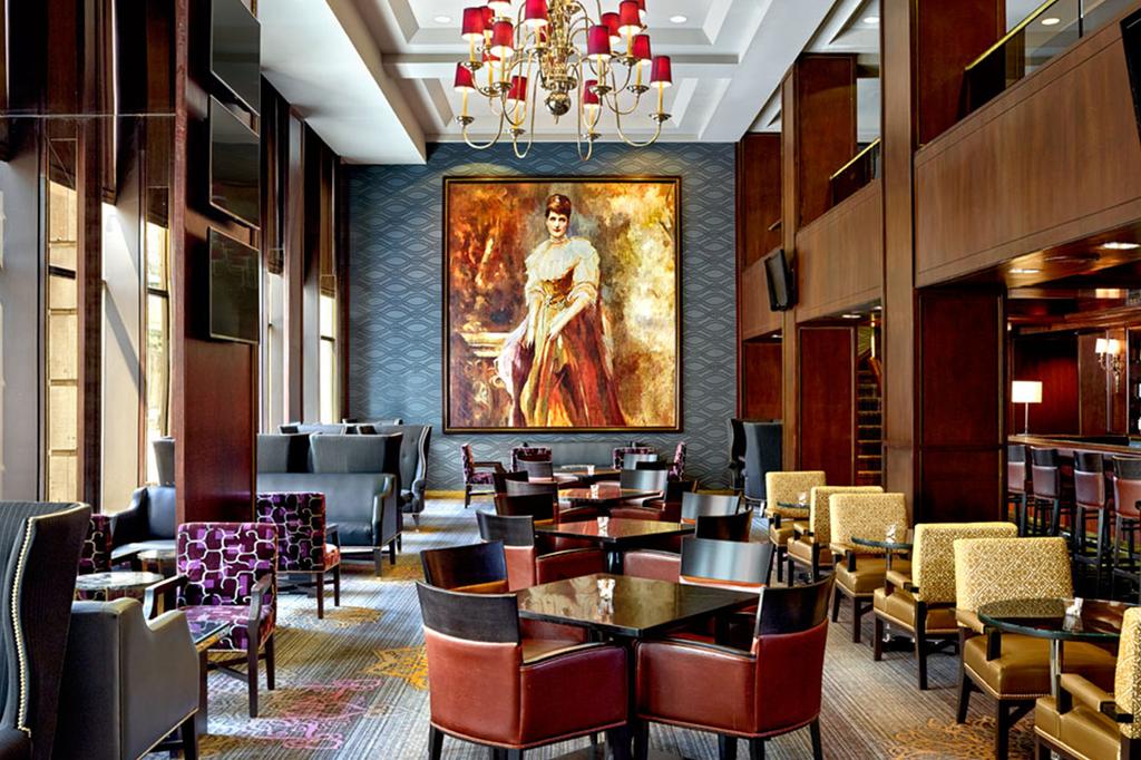 Elegant hotel bar area with classic decor and luxurious seating.