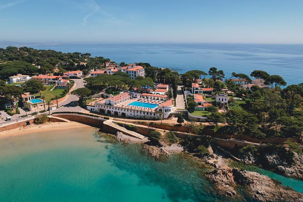 Aerial view of Hostal de La Gavina by scenic Costa Brava coast.